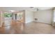 Open concept living room featuring beautiful flooring and natural light at 8600 Village Mill Row, Hudson, FL 34667