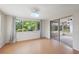 Sunroom with natural light, and sliding glass doors to a patio at 8600 Village Mill Row, Hudson, FL 34667