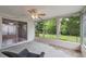 Enclosed patio with ceiling fan and outside views at 8600 Village Mill Row, Hudson, FL 34667