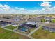 Aerial view of the property with an enclosed pool and fenced backyard at 11504 Sage Canyon Dr, Riverview, FL 33578