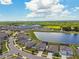 Aerial view of suburban homes near a lake at 11504 Sage Canyon Dr, Riverview, FL 33578