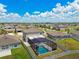 Aerial view of home with fenced backyard and enclosed pool in a suburban neighborhood at 11504 Sage Canyon Dr, Riverview, FL 33578