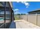 View of fenced backyard with patio and enclosed pool at 11504 Sage Canyon Dr, Riverview, FL 33578