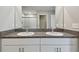 Bright bathroom features a double vanity with granite countertops and access to a walk-in shower at 11504 Sage Canyon Dr, Riverview, FL 33578