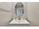 Modern bathroom featuring a sleek oval mirror and stylish single vanity at 11504 Sage Canyon Dr, Riverview, FL 33578