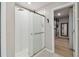 Bright bathroom featuring a glass shower, with an open door to a spacious walk-in closet at 11504 Sage Canyon Dr, Riverview, FL 33578