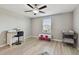 Comfortable bedroom designed with a sewing and area, lit by a ceiling fan at 11504 Sage Canyon Dr, Riverview, FL 33578