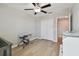 Neutral Bedroom with ceiling fan, wood-look flooring, and closet, ready for personal touches at 11504 Sage Canyon Dr, Riverview, FL 33578