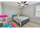Light bedroom with wood-look flooring, closet and ceiling fan at 11504 Sage Canyon Dr, Riverview, FL 33578