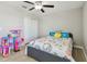 Bedroom with wood-look floors, ceiling fan, closet and window at 11504 Sage Canyon Dr, Riverview, FL 33578