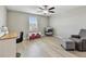 Charming bedroom features a ceiling fan, natural light, and versatile furniture arrangement at 11504 Sage Canyon Dr, Riverview, FL 33578