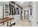 Organized walk-in closet featuring ample shelving and drawers for optimal storage solutions at 11504 Sage Canyon Dr, Riverview, FL 33578
