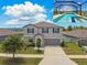 Two-story home featuring a private screened-in pool and a well-manicured lawn at 11504 Sage Canyon Dr, Riverview, FL 33578