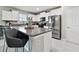 Bright kitchen with granite counters, stainless steel appliances, and modern white cabinetry at 11504 Sage Canyon Dr, Riverview, FL 33578