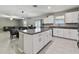 Bright kitchen features white cabinets, stainless steel appliances, and granite countertops at 11504 Sage Canyon Dr, Riverview, FL 33578
