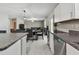 Open concept living room seamlessly connected to the dining and kitchen areas at 11504 Sage Canyon Dr, Riverview, FL 33578