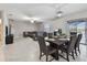Spacious living and dining area features neutral decor, tile flooring, and sliding glass doors to the lanai at 11504 Sage Canyon Dr, Riverview, FL 33578