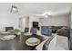 Open-concept living and dining area with modern furnishings and plenty of natural light at 11504 Sage Canyon Dr, Riverview, FL 33578