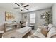 Upstairs living room with bright interior, comfortable seating, and an adjacent playroom at 11504 Sage Canyon Dr, Riverview, FL 33578
