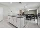 Open concept living room seamlessly connected to the dining and kitchen areas at 11504 Sage Canyon Dr, Riverview, FL 33578