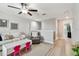 Upstairs living room with bright interior, comfortable seating, and an adjacent playroom at 11504 Sage Canyon Dr, Riverview, FL 33578