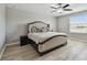 Relaxing main bedroom features a comfortable bed, ceiling fan, and large window at 11504 Sage Canyon Dr, Riverview, FL 33578