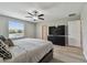Serene main bedroom features a ceiling fan, window, and access to the en-suite bathroom at 11504 Sage Canyon Dr, Riverview, FL 33578