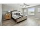 This main bedroom boasts a ceiling fan, light wood floors and a window for plenty of natural light at 11504 Sage Canyon Dr, Riverview, FL 33578