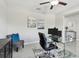 Cozy home office featuring a glass desk, comfortable seating, and stylish decor for a productive workspace at 11504 Sage Canyon Dr, Riverview, FL 33578
