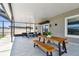 Outdoor patio with screen enclosure featuring an outdoor dining set and comfortable seating, with a view of the backyard at 11504 Sage Canyon Dr, Riverview, FL 33578
