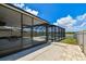 Covered patio, enclosed pool, and fenced backyard on a sunny day at 11504 Sage Canyon Dr, Riverview, FL 33578