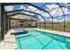 Large pool and spa on the outdoor patio with a screened enclosure perfect for outdoor fun at 11504 Sage Canyon Dr, Riverview, FL 33578
