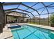 Sparkling pool with screen enclosure, complemented by patio furniture and a built-in spa at 11504 Sage Canyon Dr, Riverview, FL 33578