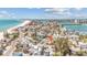 Aerial view showing the property's location near the beach and waterway in a coastal community at 121 86Th Ter, Treasure Island, FL 33706