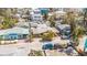 Aerial view of neighborhood with tropical trees and foliage, close to the beach at 121 86Th Ter, Treasure Island, FL 33706