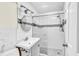 Modern bathroom with glass-enclosed shower, white subway tile, and updated fixtures at 121 86Th Ter, Treasure Island, FL 33706
