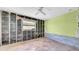 Bedroom featuring terracotta tile flooring, ceiling fan, and natural light at 121 86Th Ter, Treasure Island, FL 33706
