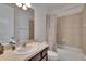 This is a full bathroom featuring tile surround, shower-tub combo and single sink vanity at 12134 Creek Preserve Dr, Riverview, FL 33579