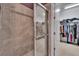 Shower room with tiled shower and walk-in closet at 12134 Creek Preserve Dr, Riverview, FL 33579