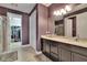 Well-lit bathroom featuring double sinks and walk-in closet at 12134 Creek Preserve Dr, Riverview, FL 33579