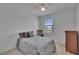 Bright bedroom features a window and a dresser with space for activities at 12134 Creek Preserve Dr, Riverview, FL 33579