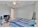 Bedroom features neutral colored walls with a ceiling fan and view from the window at 12134 Creek Preserve Dr, Riverview, FL 33579
