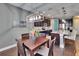Dining area flows into the gourmet kitchen with pendant lighting and modern appliances at 12134 Creek Preserve Dr, Riverview, FL 33579