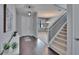 Inviting entryway features dark wood floors, staircase and leads into an open living space at 12134 Creek Preserve Dr, Riverview, FL 33579