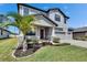 Lovely two-story home with a well-kept lawn, complete with a welcoming front porch and a spacious two-car garage at 12134 Creek Preserve Dr, Riverview, FL 33579