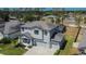 Two story home with a three car garage, lovely front porch and landscaping at 12134 Creek Preserve Dr, Riverview, FL 33579