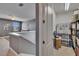 Hallway with a storage room features a view of a living room with a ceiling fan at 12134 Creek Preserve Dr, Riverview, FL 33579