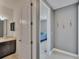 Hallway view with bathroom and bedroom, neutral paint, carpet and vase decals at 12134 Creek Preserve Dr, Riverview, FL 33579