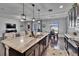 Open kitchen boasts pendant lighting, marble countertops, and an eat-in dining area at 12134 Creek Preserve Dr, Riverview, FL 33579