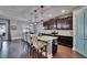 Large open kitchen with granite countertops, stainless appliances, and pendant lights at 12134 Creek Preserve Dr, Riverview, FL 33579